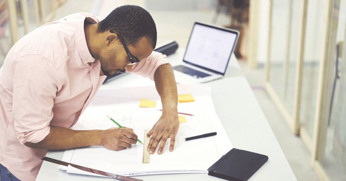 architect drawing a house plan