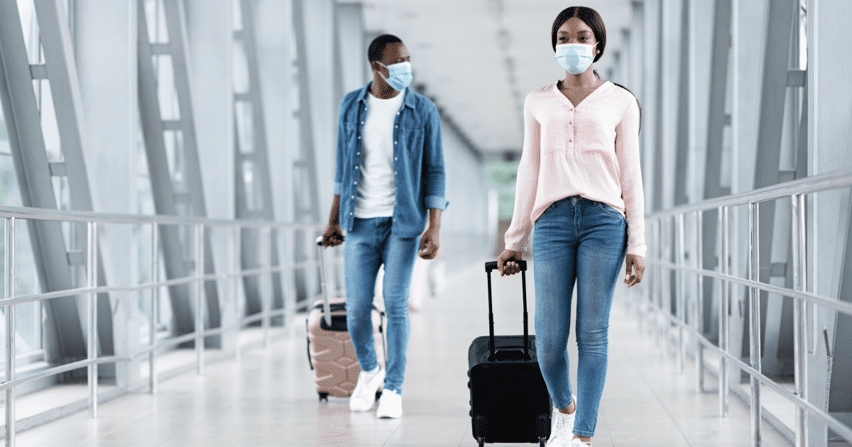 couple with travel bags